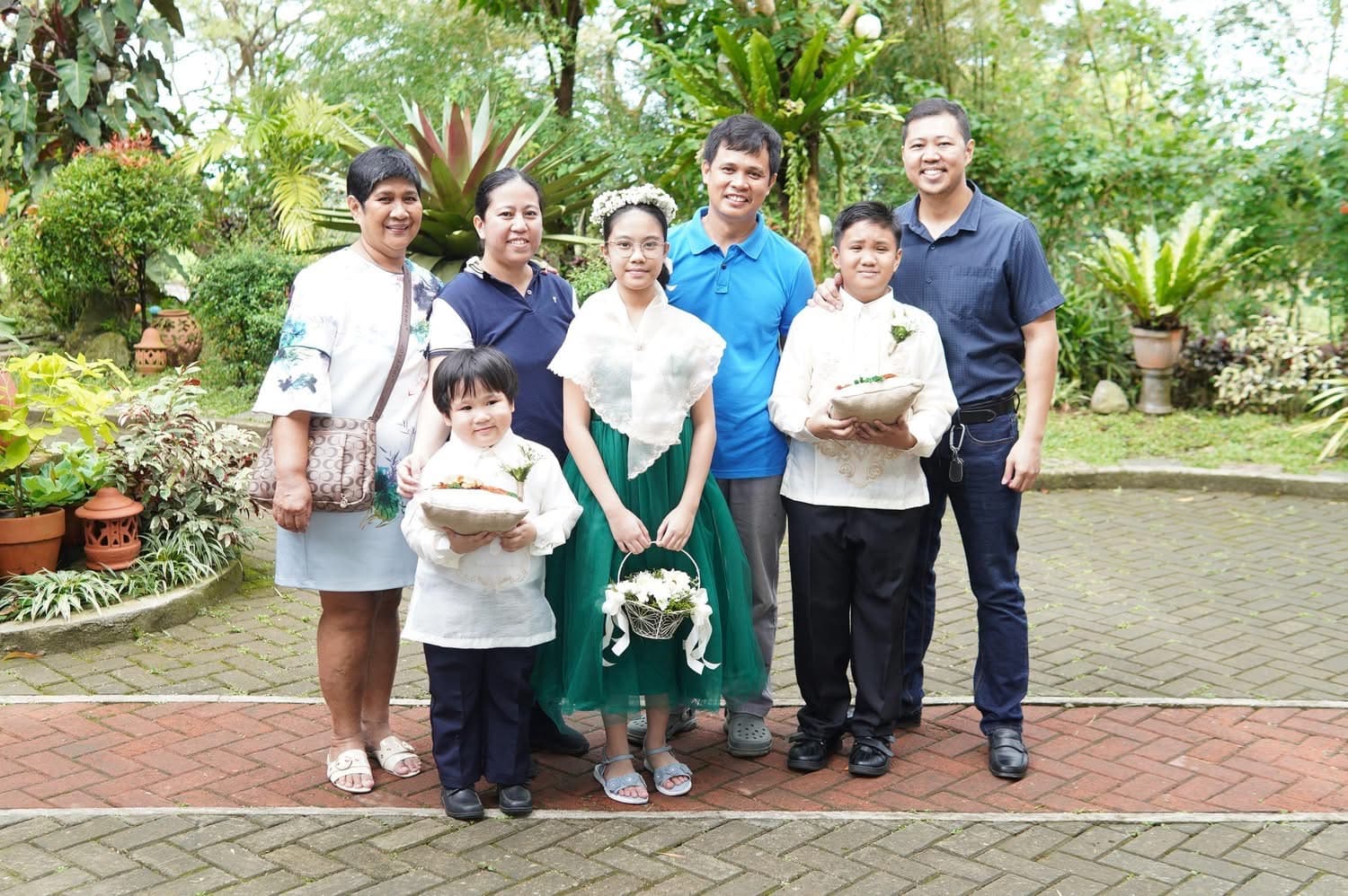 Rica Eve with family at an outdoor celebration before her HLH diagnosis